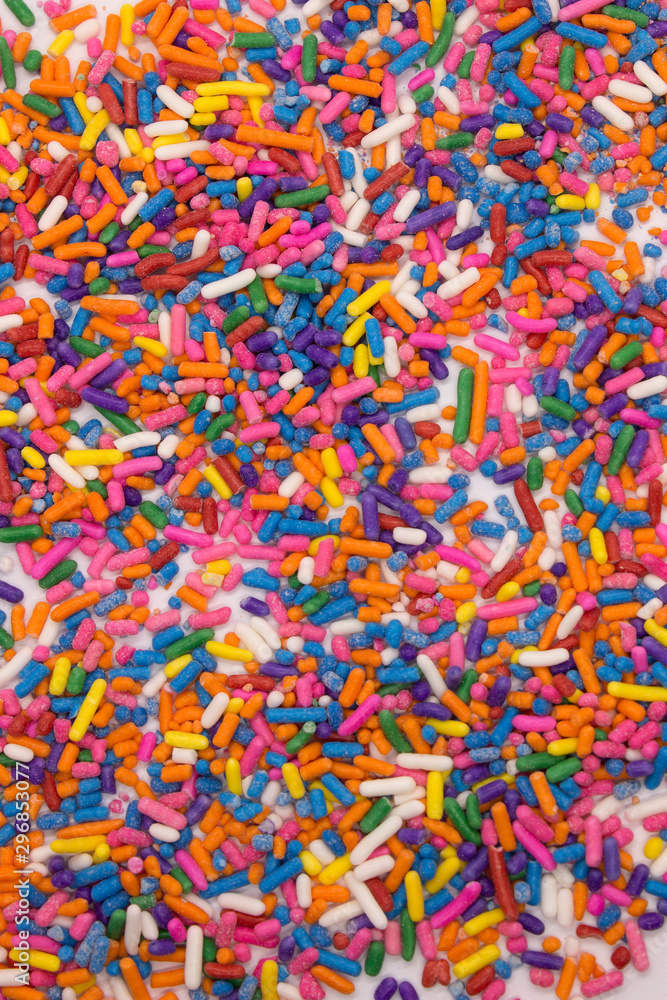 This is a photograph of colorful sprinkles isolated on a White background This is a photograph of colorful sprinkles isolated on a White background