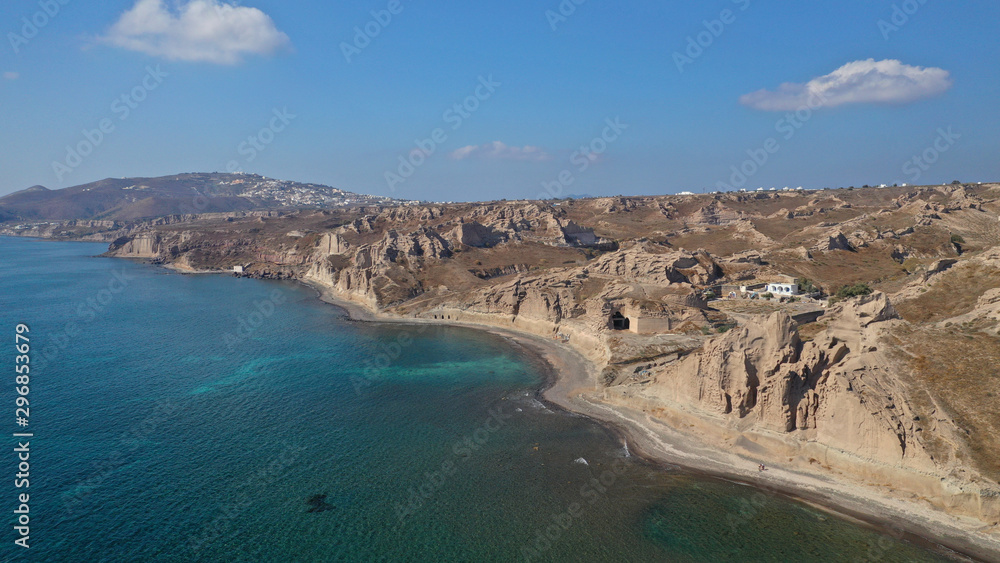 Aerial drone photo of amazing shape giant volcanic rock formations in Vlychada beach, Santorini island, Cyclades, Greece