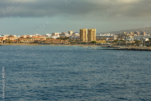 Los Cristianos - Las Americas, Tenerife, Spain - May 25, 2019: View to the coastline from the ferry departing for the island of La Gomera early morning from the port of Los Cristianos © Yury