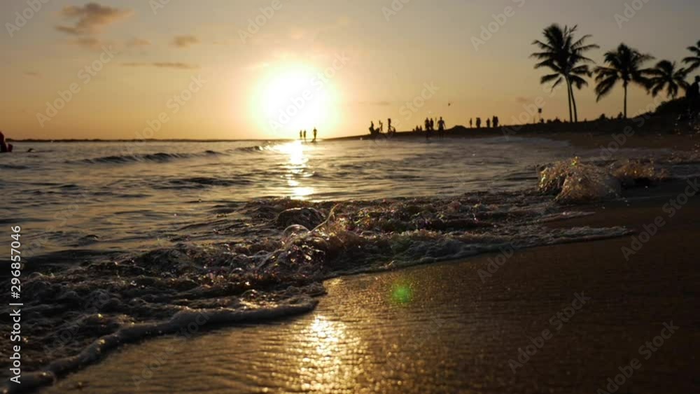 Slow Motion Sunset Ocean Beach, People playing in water, Hawaii Coast Slow Motion Sunset Ocean Beach, People playing in water, Hawaii Coast