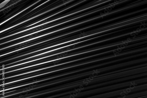 This is a photograph of Black plastic straws