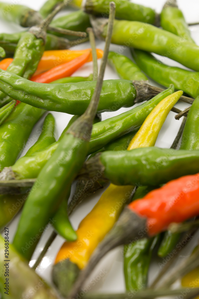 This is a photograph of Thai Chili peppers isolated on a White background This is a photograph of Thai Chili peppers isolated on a White background