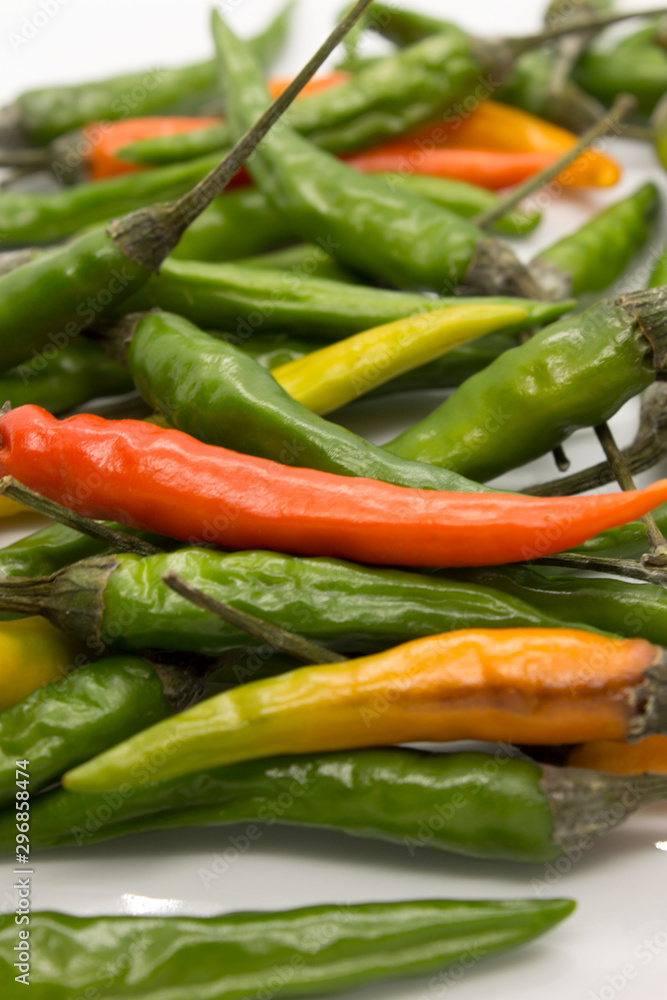 This is a photograph of Thai Chili peppers isolated on a White background This is a photograph of Thai Chili peppers isolated on a White background