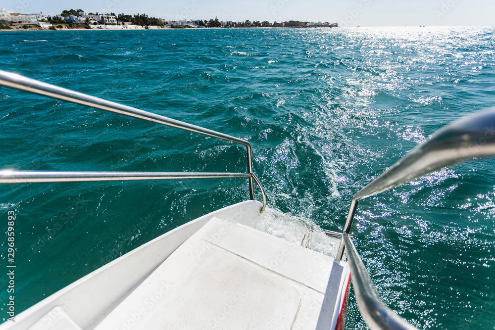 Railing stairs for diving on a catamaran.Ladder of a sailing yacht to