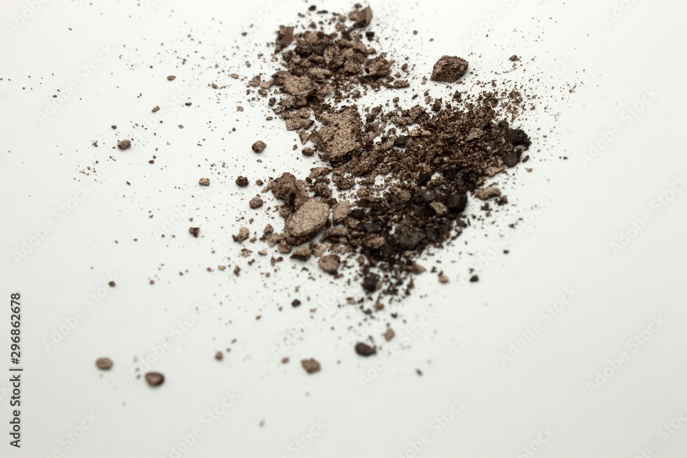 This is a photograph of a light Brown powder eyeshadow isolated on a White background This is a photograph of a light Brown powder eyeshadow isolated on a White background