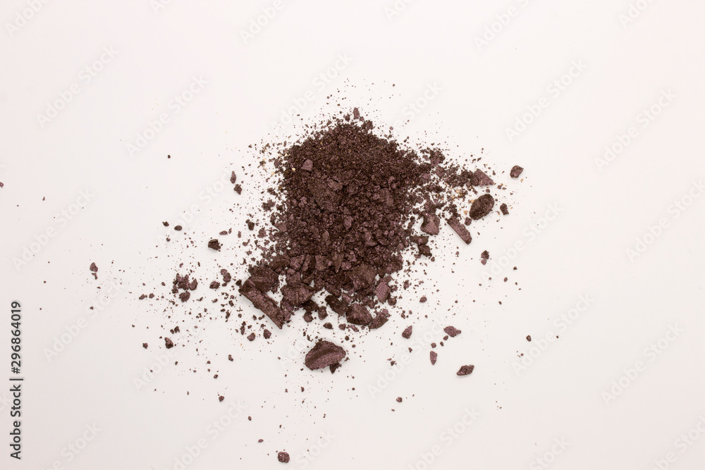 This is a photograph of a Dark Purple powder Eyeshadow isolated on a White background This is a photograph of a Dark Purple powder Eyeshadow isolated on a White background