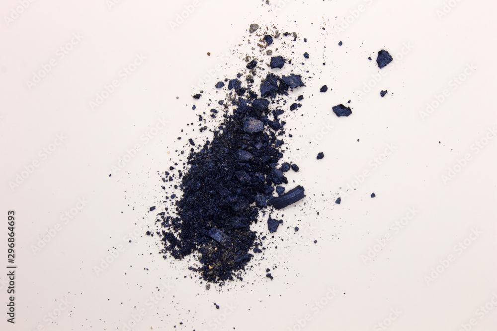 This is a photograph of Shimmery Royal Blue powder Eyeshadow isolated on a White background