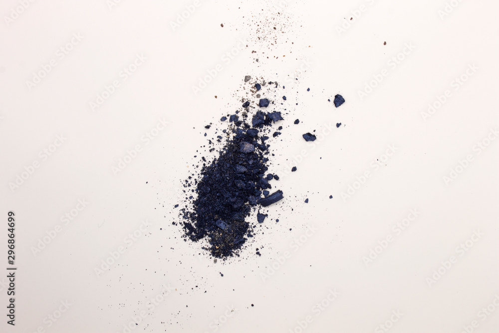 This is a photograph of Shimmery Royal Blue powder Eyeshadow isolated on a White background