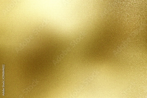 Brushed gold hard metal wall with scratched surface, abstract texture background