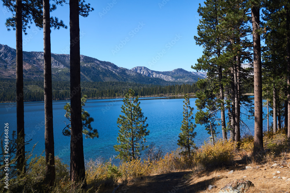 Beautiful scenery of the Sierra Nevada Mountains with a colorful lake in the foreground