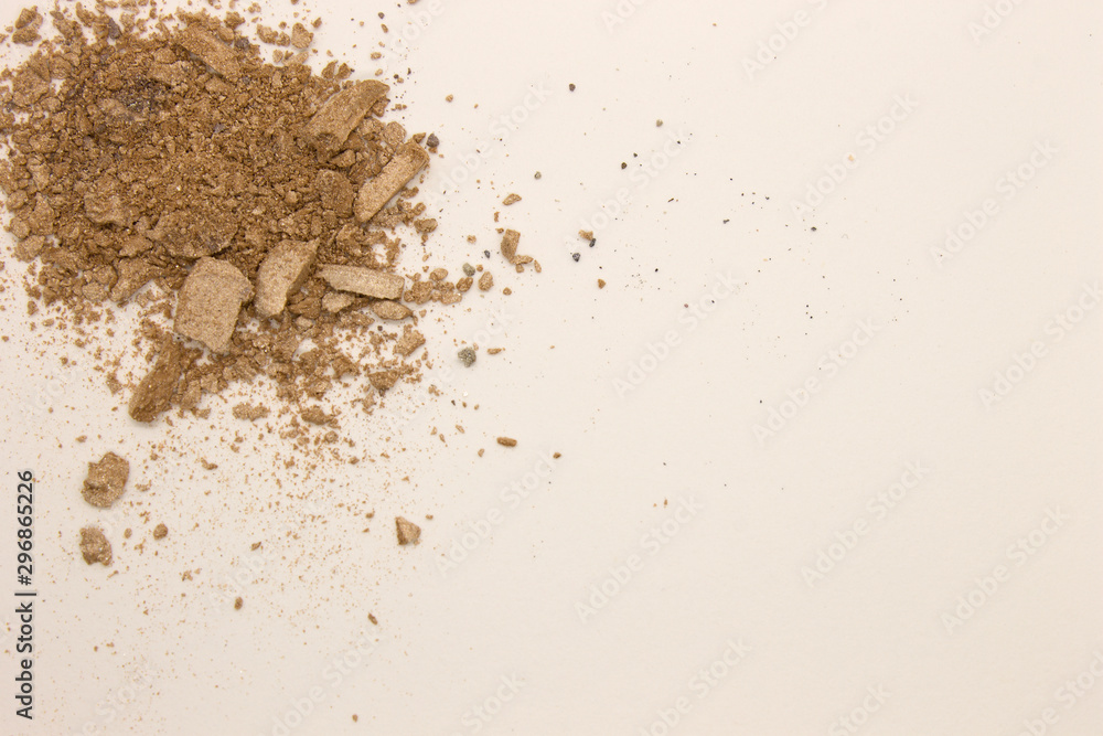 This is a photograph of pale Taupe powder Eyeshadow isolated on a White background