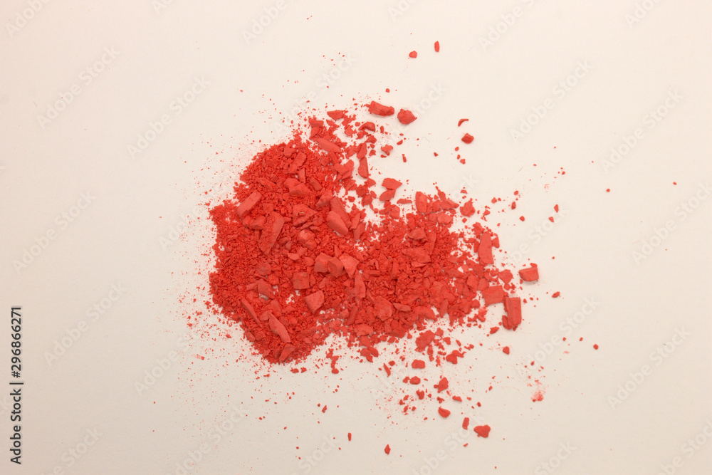 This is a photograph of Orange powder Blusher isolated on a White background