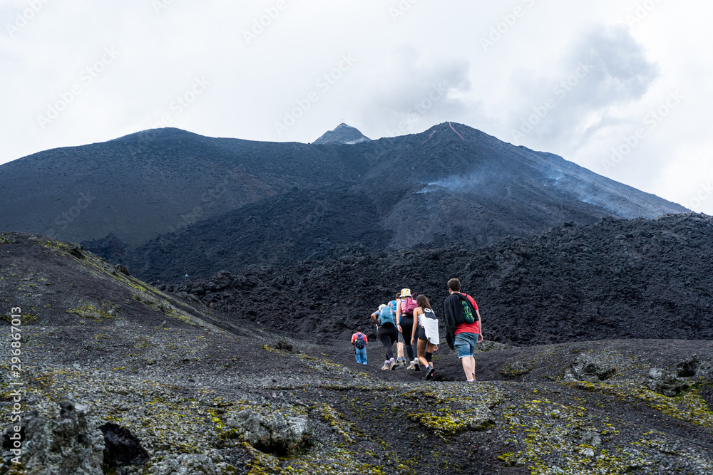 Tourists line up to the top of the Pacaya volcano in Guatemala.