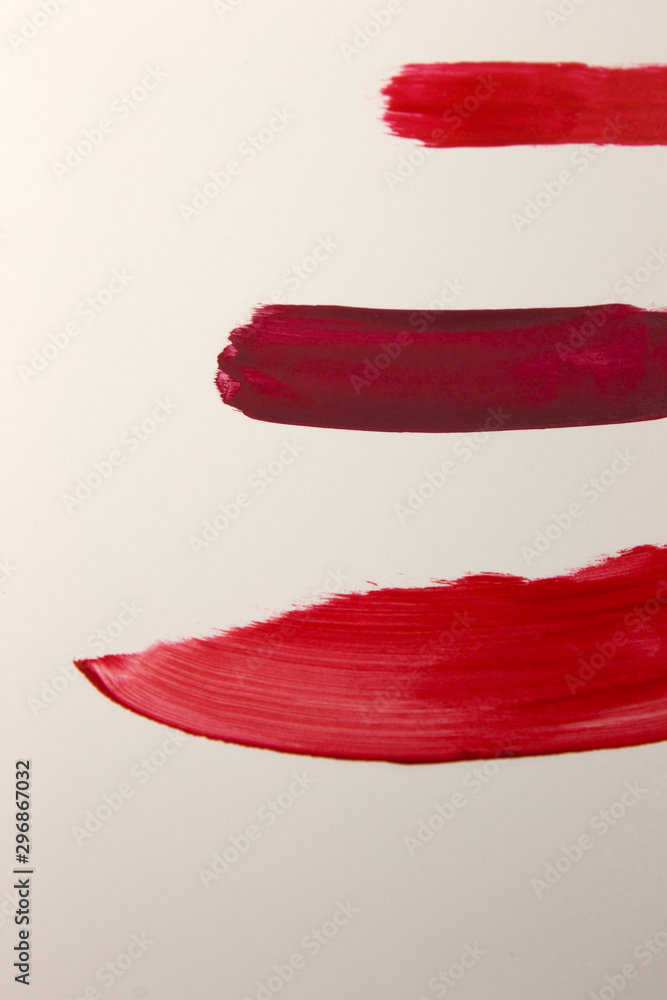 This is a photograph of Red Lipstick swatches isolated on a White background This is a photograph of Red Lipstick swatches isolated on a White background