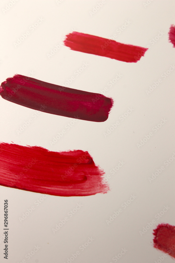 This is a photograph of Red Lipstick swatches isolated on a White background This is a photograph of Red Lipstick swatches isolated on a White background