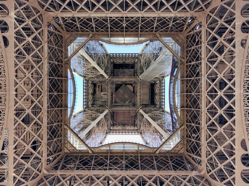 View looking straight up from underneath the Eiffel Tower in Paris, France