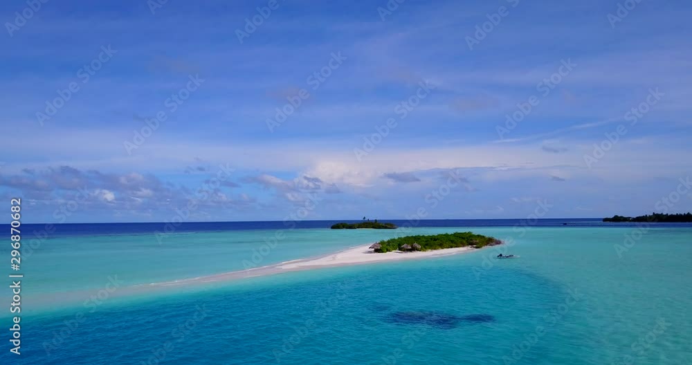Isolated islands called Motus, in crystal clear water with coral reef, aerial drone pan shot Isolated islands called Motus, in crystal clear water with coral reef, aerial drone pan shot