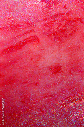 This is a photograph of a Red Lip gloss swatch background