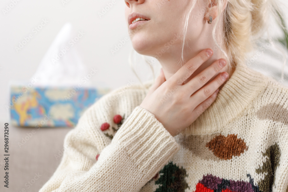 The girl in the sweater is sick. Colds and flu. The patient caught a cold, feeling sick. Unhealthy girl with a sore throat. The girl in the sweater is sick. Colds and flu. The patient caught a cold, feeling sick. Unhealthy girl with a sore throat.