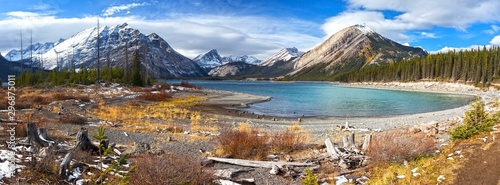 Autumn Colors, Distant Snowcapped Mountain Peaks and Wide Panoramic Landscape of upper Kanananskis Lake in Canadian Rockies, Alberta Canada photo