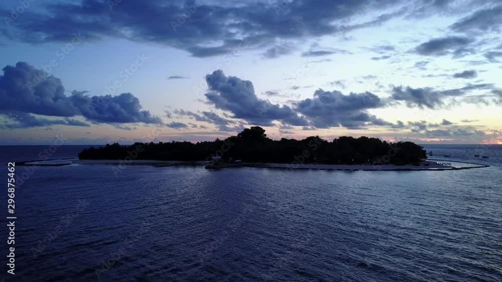 Low angle zooming view of amazing cloudy sky on sunset at tropical island in Indian Ocean Low angle zooming view of amazing cloudy sky on sunset at tropical island in Indian Ocean