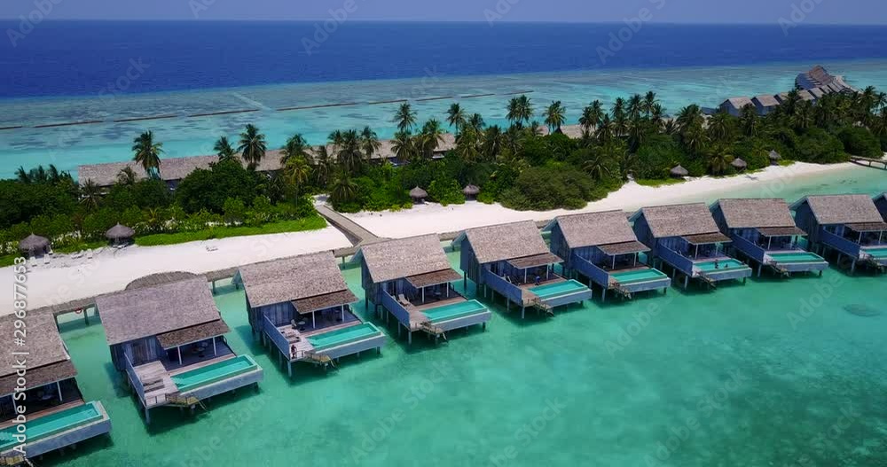 Close up form above of beautiful bungalows with private pool on emerald water of Guadeloupe island Close up form above of beautiful bungalows with private pool on emerald water of Guadeloupe island