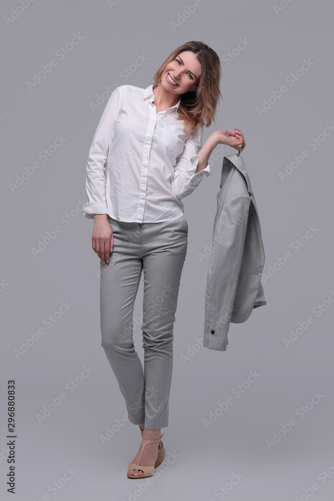 smiling business woman with a jacket over her shoulder. isolated on white smiling business woman with a jacket over her shoulder. isolated on white