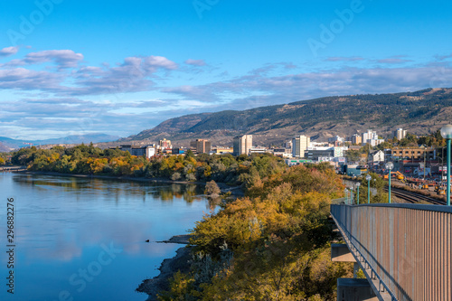 2019-10-03 Kamloops, BC, Canada. Riverside Park. View of Thompson River, Kamloops downtown buildings, mountains, trees. photo