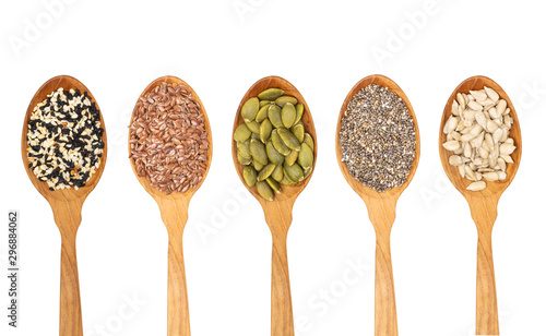 organic grains seeds in wooden spoon,.Chia seed, Sesame,Flax isolated on white background