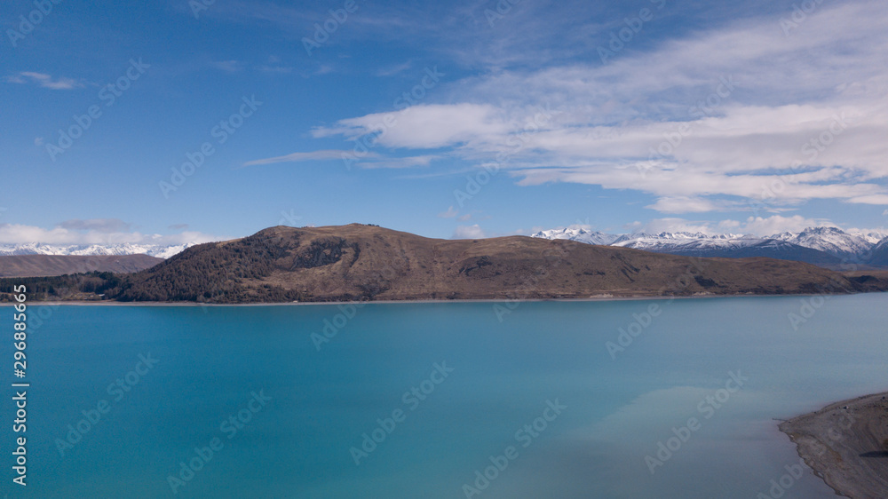 Lake Tekapo aerial view during sunny day. Lake Tekapo aerial view during sunny day.