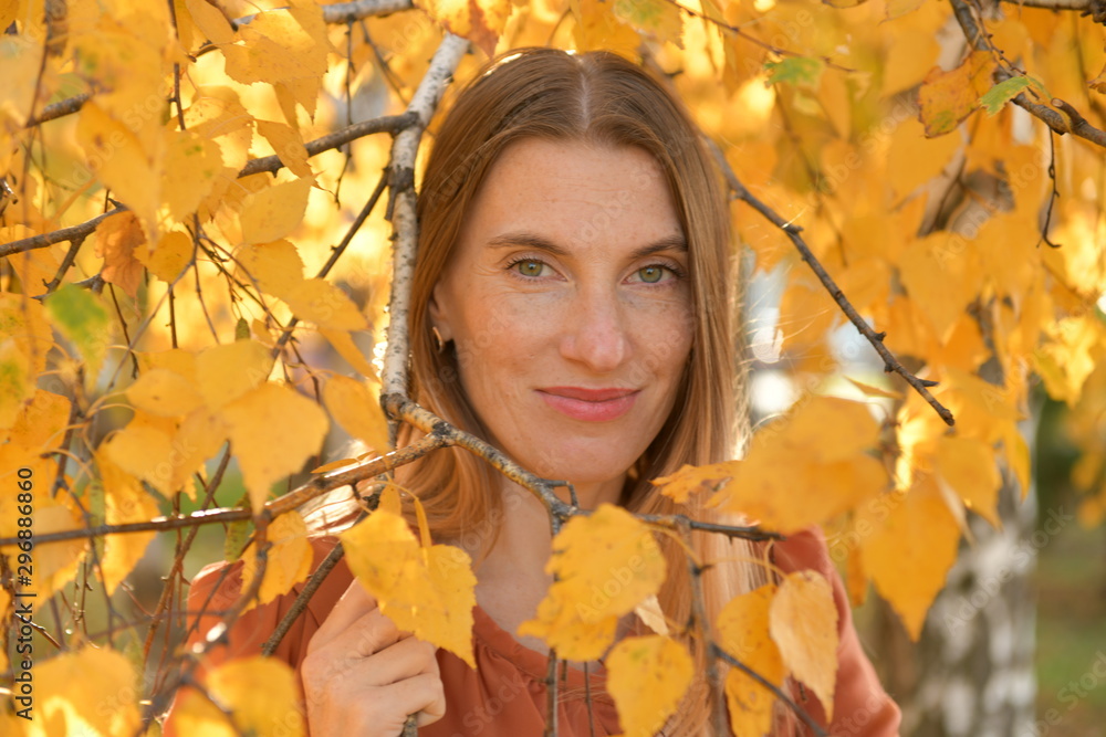 portrait of young woman in autumn park portrait of young woman in autumn park