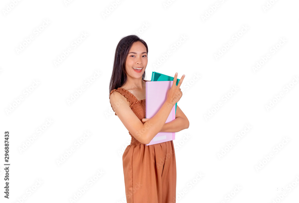 Asian girl in brown tank top hold books in her hands Asian girl in brown tank top hold books in her hands