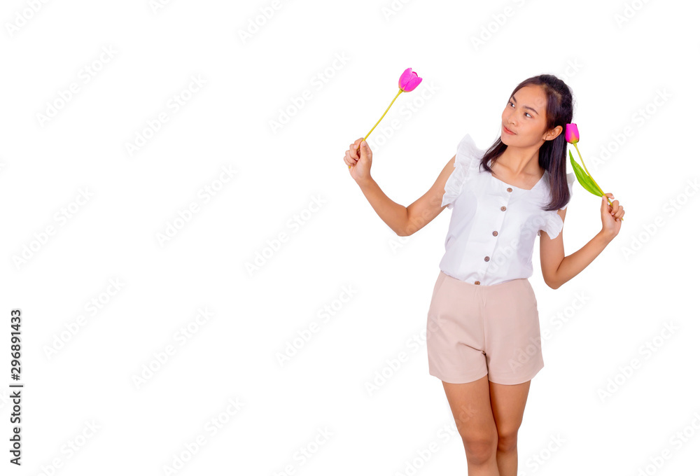 An Asian girl in white tank top and baige trunk holds pink plastic flower in her hands. An Asian girl in white tank top and baige trunk holds pink plastic flower in her hands.