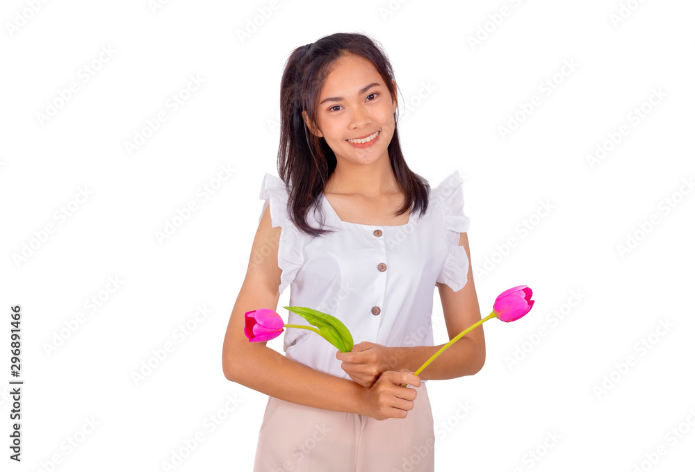 An Asian girl in white tank top and baige trunk holds pink plastic flower in her hands. An Asian girl in white tank top and baige trunk holds pink plastic flower in her hands.