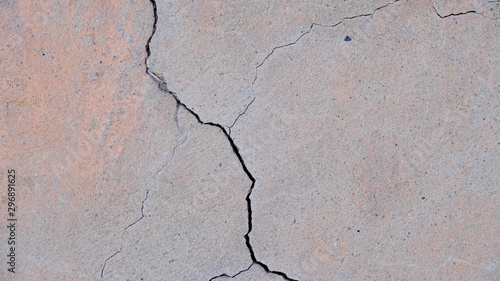  A crack on the concrete wall surface of a house in Los Angeles. Background image for your design