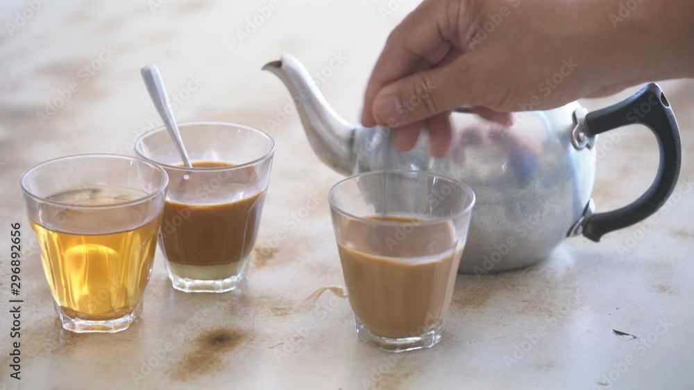 making of tradition hot milk tea on table making of tradition hot milk tea on table