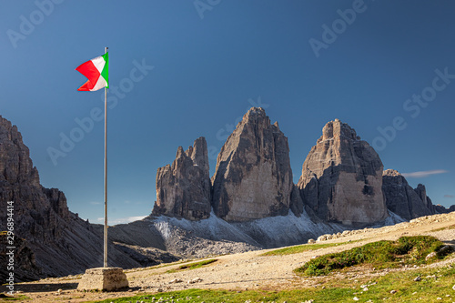 Italian flag and Tre Cime di Lavaredo at sunrise, Dolomites