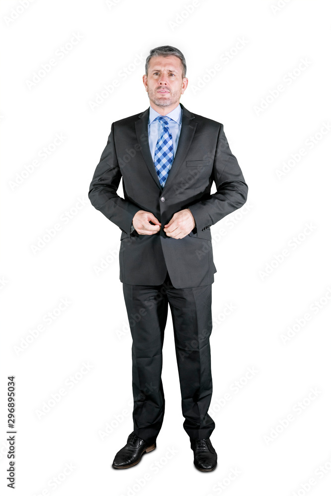 Caucasian businessman buttoning his suit on studio Caucasian businessman buttoning his suit on studio