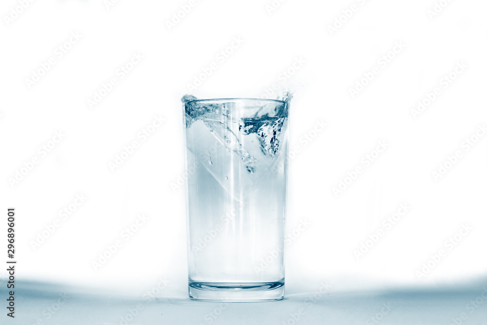 Water splashes in a glass of water Water splashes in a glass of water