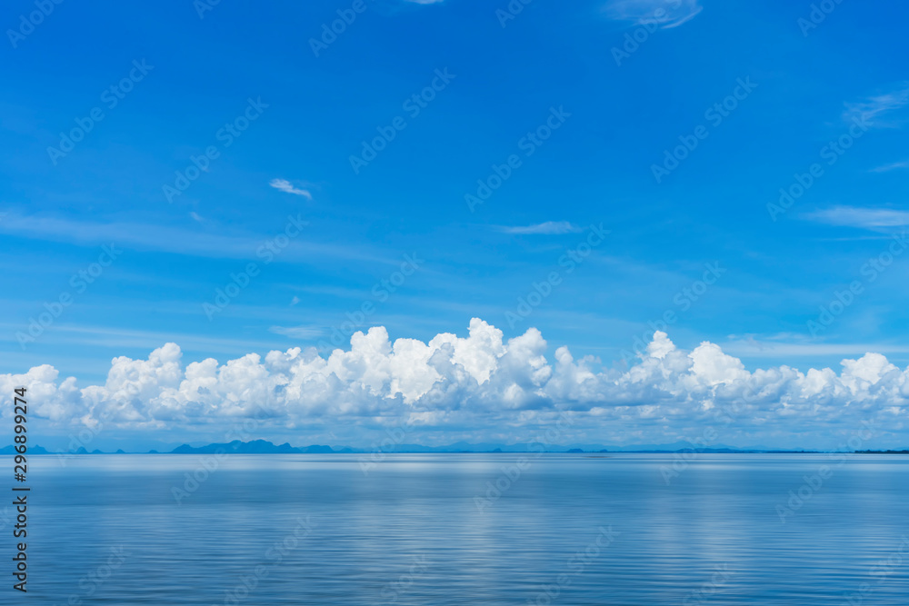 Blue sky background with white clouds on the lake. - obrazy, fototapety, plakaty 