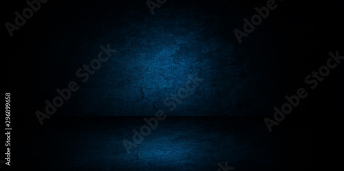 Abstract image of Studio dark blue room gradient background for interior decoration. © Angkana
