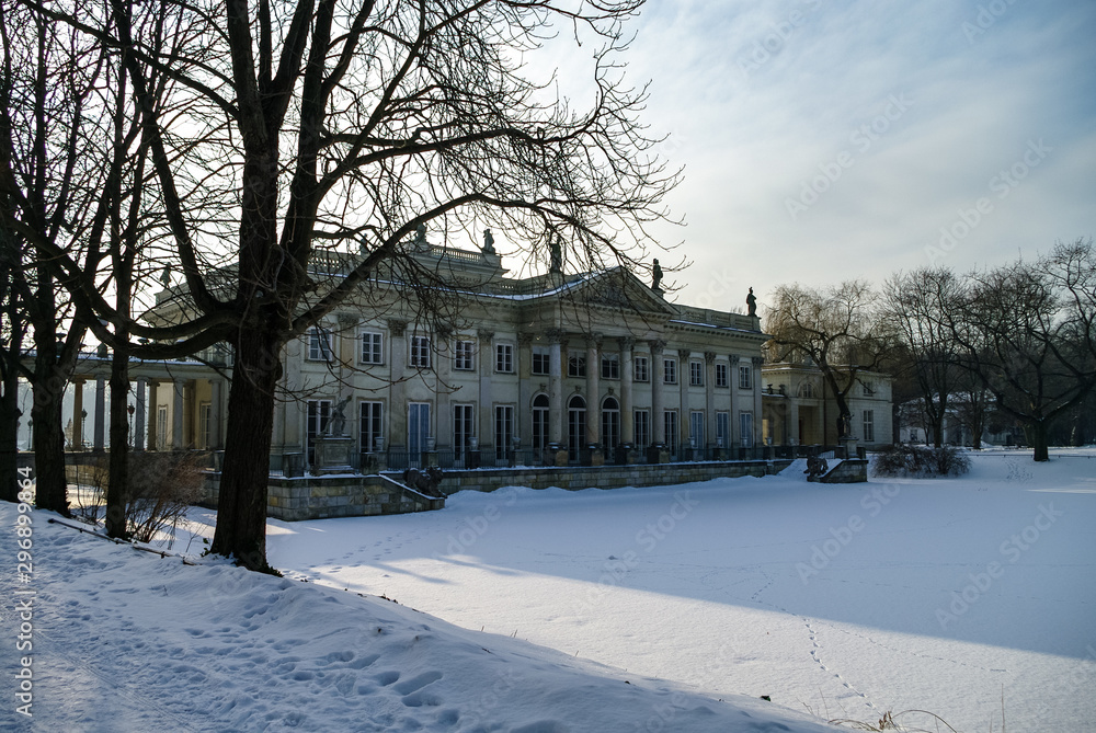 The Lazienki palace in Lazienki Park. Winter landscape with snow. Warsaw. Lazienki Krolewskie, Poland The Lazienki palace in Lazienki Park. Winter landscape with snow. Warsaw. Lazienki Krolewskie, Poland