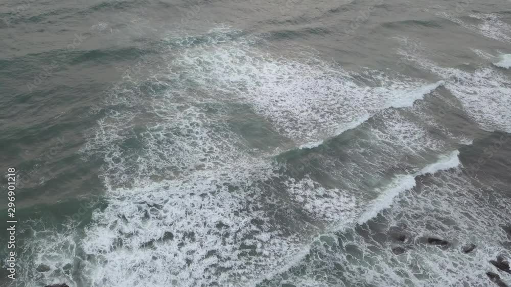 Aerial view of wave coming on the overcast day. Aerial view of wave coming on the overcast day.