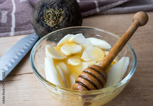 Black radish, cut into pieces with a knife, in honey