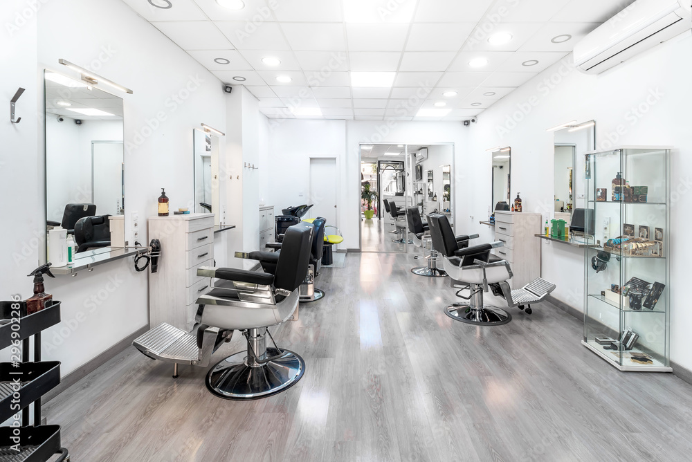 Modern bright hair and beauty salon. Barber salon interior business with black and white luxury decor. - obrazy, fototapety, plakaty 