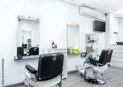 Modern bright hair and beauty salon. Barber salon interior business with black and white luxury decor.