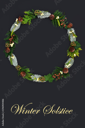 Картината върху платно Natural winter solstice wreath with flora and fauna on dark grey background with copy space and text