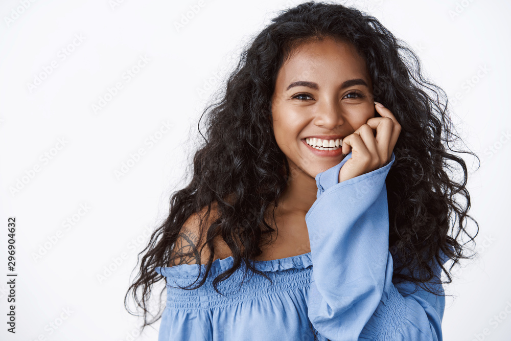 Close-up tender feminine african american woman with black curly hairstyle,  touching cheek flirty, laughing happily, having fun time hanging around  friends, office party, standing white background Stock Photo | Adobe Stock