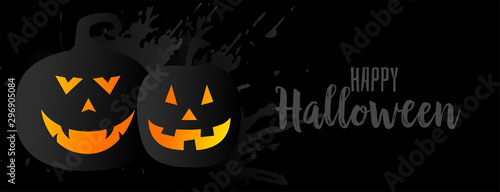 black halloween background with two pumpkins