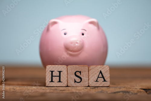 Health Savings Account Letters Near Piggybank photo